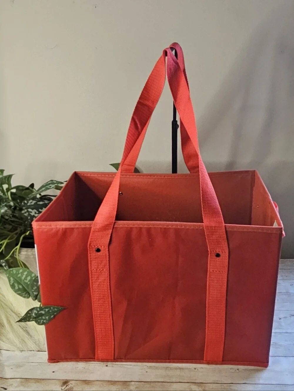 Target red collapsible box-style utility bag. It features a rectangular, boxy sh